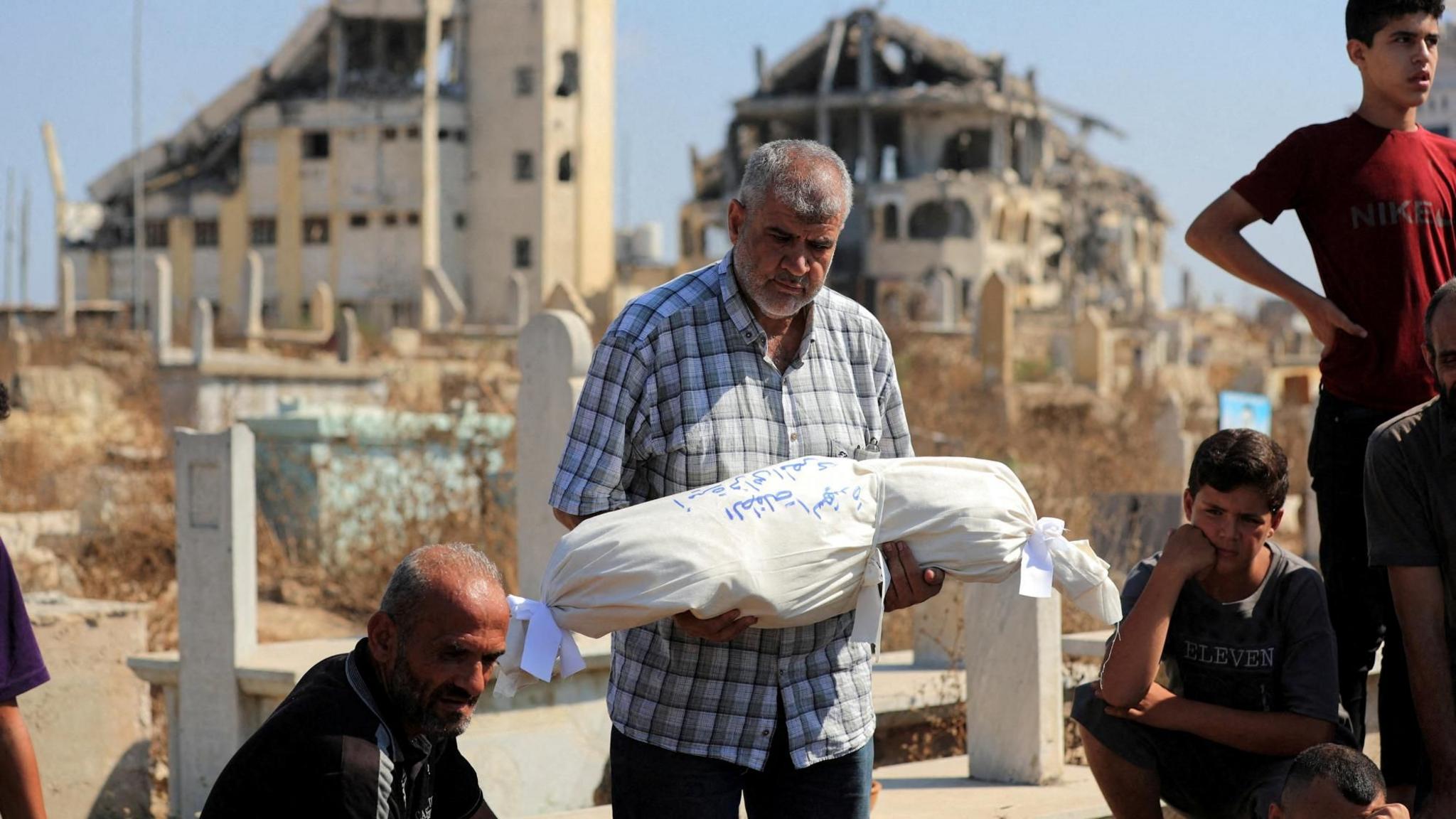 Israeli Strike Claims 12 Lives in Gaza; Six Are from One Family
