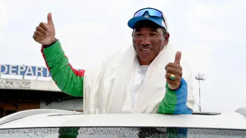 'Everest Man' and 'Mountain Queen' Achieve Historic Summit Feats
